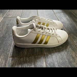 Gold stripe adidas shoes size 9 in women